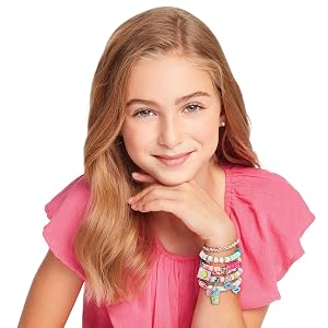 Kid showing a handmade Summer Vibes bracelet